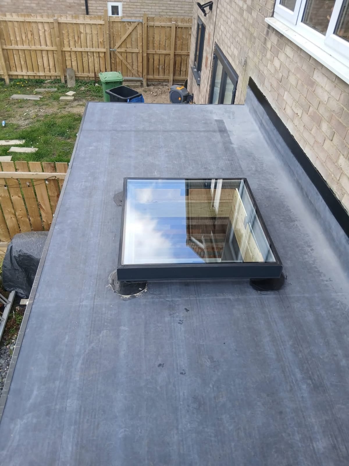 Finished flat roof surface and lantern frame